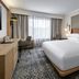 Sheraton Nashville Brentwood guest room with king bed, desk, and large window in Brentwood