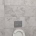 Cann Hotel, Konakli: tiled bathroom wall with toilet and flush plate