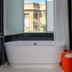 Poli House By Afi Hotels in Tel Aviv bathroom with freestanding tub and city view