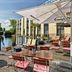 Outdoor terrace at Four Points Flex by Sheraton Ratingen Düsseldorf Airport with pond views and seating