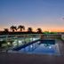 San Diego Suites Pampulha Hotel rooftop pool at sunset in Belo Horizonte