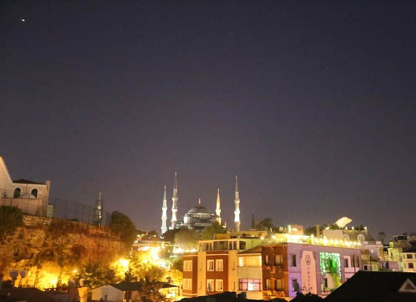My Holiday Time Hotel Istanbul rooftop view with the Blue Mosque lit up at night