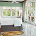 Couples Negril in Negril bedroom with glass doors to a balcony and tropical garden view