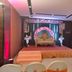 Royal Orchid Central Jaipur, Bani Park: floral-decorated stage with ornate sofa and banquet seating in Jaipur