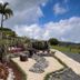 Hotel Montaña Monteverde in Santa Elena with landscaped garden, stone pathways, palm trees and mountain views
