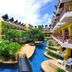 Woraburi Phuket Resort & Spa, Karon: lagoon pool courtyard with tropical landscaping and balconies