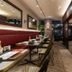 DEL style Fukuoka Nishinakasu by Daiwa Roynet Hotel dining area in Fukuoka with booth seating and open kitchen