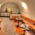 Hotel Svambersky dum in Český Krumlov breakfast room with orange chairs and set dining tables