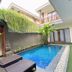 De' Bharata Bali Villas in Kuta: courtyard plunge pool with lounge chairs and villa balconies