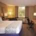 La Quinta Inn & Suites by Wyndham Sarasota Downtown room with king bed, desk, TV and window view