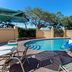 La Quinta Inn & Suites by Wyndham Sarasota Downtown outdoor pool with lounge chairs in Sarasota