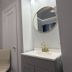 Twin Peaks Hotel San Francisco bathroom with sink, round mirror, chair and radiator