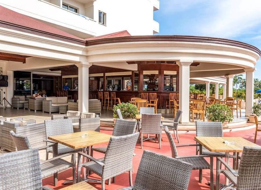 Nissiana Hotel & Bungalows in Ayia Napa outdoor bar and terrace with tables and chairs
