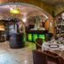 Hôtel Colbert Palace in Antananarivo wine cellar restaurant with barrel decor and set dining tables