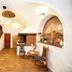 Hotel Svambersky dum lobby with staircase, brick fireplace, and arched ceiling in Český Krumlov