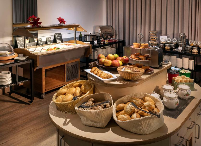 Breakfast buffet at Best Western Hotel Achim Bremen in Achim with pastries, fruit, breads and drinks