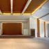 Luisita Central Park Hotel in Tarlac City lobby with a large stage and warm wood-accent ceiling