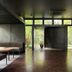 Sumiya Kiho-An Ryokan in Kameoka lounge with wood floors and floor-to-ceiling garden views