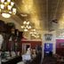 Hearthstone Elegant Lodge by the River in Kamiah lounge with chandeliers and wood-paneled decor
