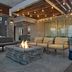 Home2 Suites by Hilton Anchorage/Midtown outdoor fire pit lounge with seating and string lights