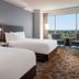 Horseshoe Tunica guest room with two beds and floor-to-ceiling window overlooking Tunica Resorts