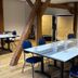 Meeting room at Hotel & Spa Wasserschloss Westerburg in Huy with tables, blue chairs and wooden beams