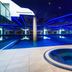 Atrium Hotel Heathrow in Hounslow features an indoor pool and a round hot tub with blue lighting
