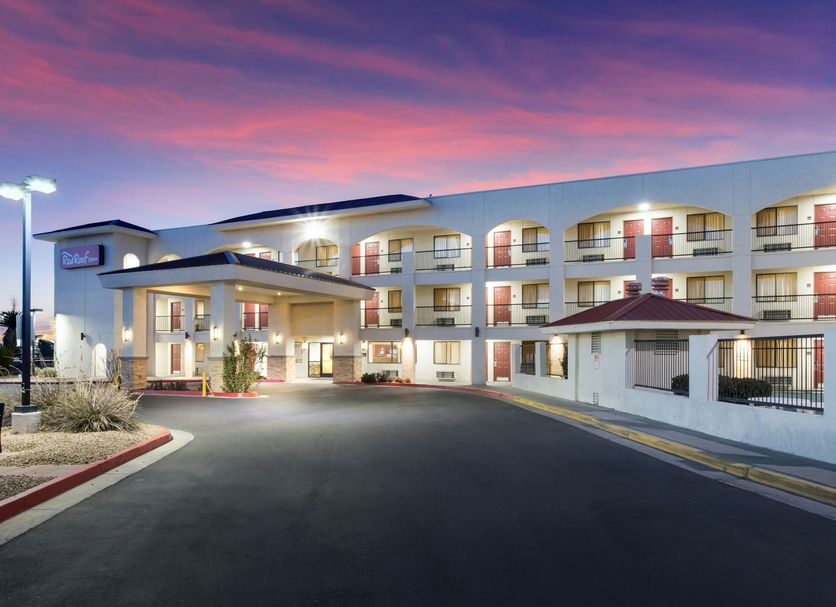 Red Roof Inn Albuquerque - Midtown exterior at dusk with arched balconies and illuminated entrance