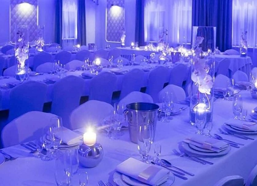 Zlote Deby Warsaw banquet hall with round tables set for a formal event