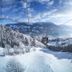 Wohlfühlhotel Schiestl in Fügenberg with a ski lift over snowy mountain slopes and valley views
