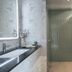 The Path Siam Bangkok bathroom with walk-in shower, black vanity, and large mirror