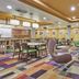 Fairfield Inn & Suites by Marriott Burlington lobby seating area with colorful patterned carpet
