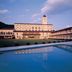 Akiu Resort Hotel Crescent in Sendai with a pool reflecting the hotel at dusk