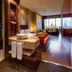 Olivia Plaza Hotel Barcelona guest room with open bathroom and city skyline view
