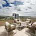 Hilton Colon Guayaquil rooftop terrace with seating and city views in Guayaquil