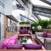 Hotel Eclat Beijing rooftop lounge with skylights, purple seating and lush greenery in Beijing