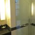 Hotel Menara Bahtera Balikpapan bathroom with glass shower enclosure and illuminated vanity mirror