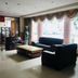 Lobby lounge at Dalian Jinbai International Hotel in Dalian with sofas, coffee table and large windows