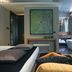 Triviho Hotel Rome guest room with freestanding tub, king bed, and contemporary art