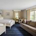 Blue Rock Resort in South Yarmouth guest room with two beds, sofa, and windows