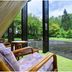 Nikko Yumoto Onsen Honokana Yado Jurin in Nikkō, guest seating with forest garden view through glass doors