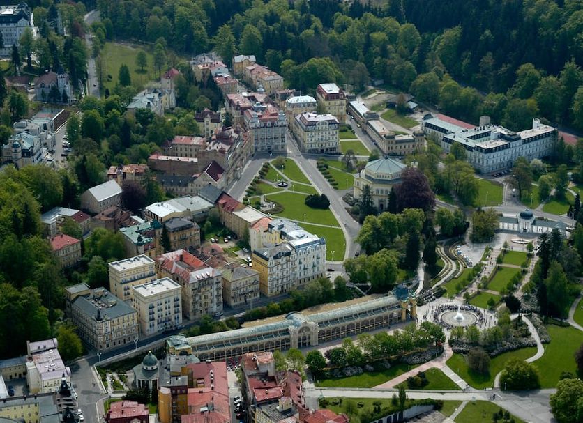 Sun Palace Wellness Hotel in Mariánské Lázně overlooking parkland and town buildings