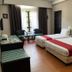 Hotel Seri Malaysia Genting Highlands room with two double beds and a window seating area