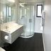 Seabrook Hotel in Somerset bathroom with glass shower, floating vanity and toilet