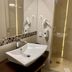 Granada Konferencia Wellness Sport Hotel Kecskemét bathroom with modern sink and glass shower stall