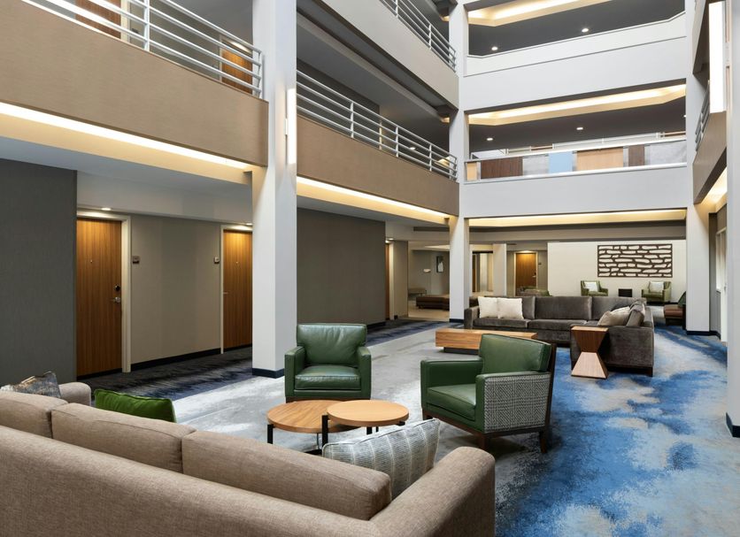 Fairfield Inn & Suites by Marriott Denver Southwest/Lakewood lobby with seating area and multi-story atrium in Lakewood