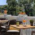 La Palmeraie in La Baule-Escoublac terrace with wicker chairs, drinks, and fruit on tables