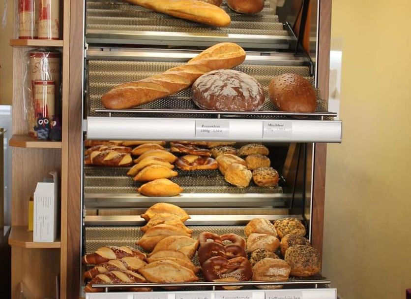 Hotel Uhl in Rothenburg ob der Tauber shows a bakery display with assorted breads and pastries.