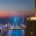 Sheraton The Walk, Dubai with panoramic Dubai Marina view and illuminated Ferris wheel at sunset