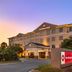 Best Western Plus Valdosta Hotel & Suites exterior at dusk in Valdosta with entrance and sign